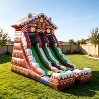 Toboggan gonflable de Noël à double piste en forme de pain d'épices pour entreprises