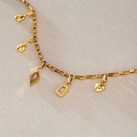 Ensemble collier et bracelet avec pendentif géométrique en acier inoxydable plaqué or 18 carats et zirconiums cubiques, hypoallergénique, délicat et minimaliste, pour femmes.