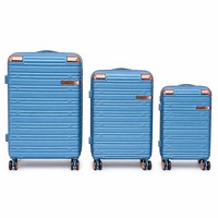 Valise de voyage rigide en ABS bleu avec protection d'angle or rose, texture à nervures horizontales, bagage à main, vente en gros OEM