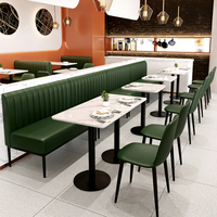 Ensemble de meubles de restaurant en cuir PU moderne et durable, canapé avec sièges en cuir, table avec plateau en marbre et structure en métal pour restaurant occidental