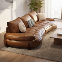 Canapé modulable en cuir Cognac Dune Cloud avec ottoman, pieds en bois capitonnés, accoudoirs rembourrés, mobilier de salon