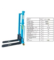 Chariot élévateur à fourche monté sur camion Tambolift modèle 1200, capacité 1T, hauteur de levage 1,6 m, fonctionnement manuel, entraînement électrique à roues motrices