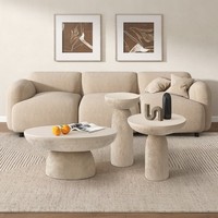Tables basses rondes en béton d'inspiration naturelle, finition texturée sable Table d'appoint centrale pour un usage quotidien