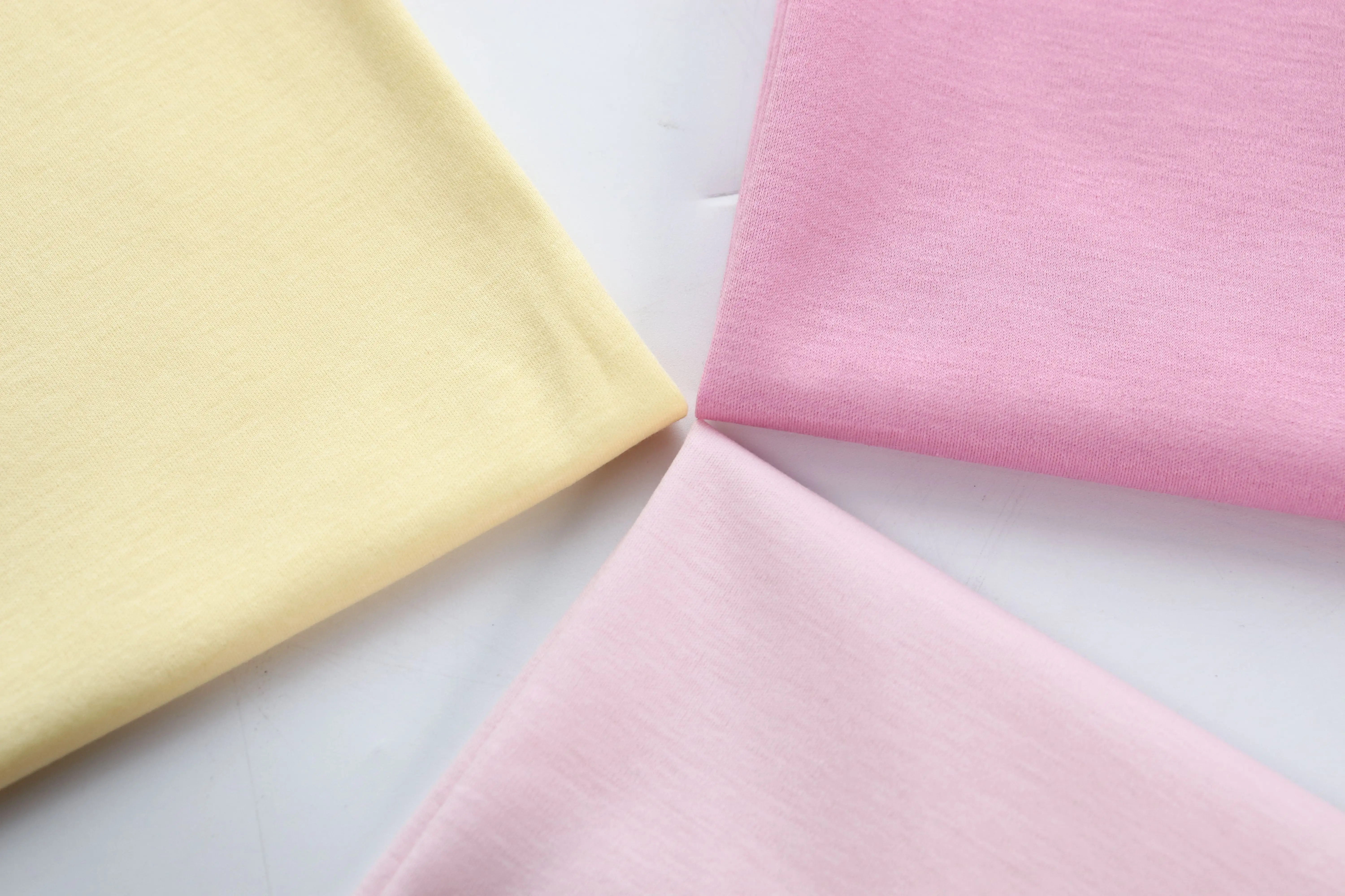 50s merserize küçük adedi mix renkler toptan 100% pamuk düz boyalı jersey interlok örme kumaş bebek giysileri için