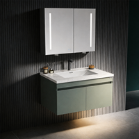 Meuble de salle de bain suspendu avec vasque intégrée en céramique blanche et miroir à bande LED verticale