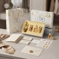 Boîte cadeau rigide personnalisée en gros avec couvercle et base, insert doré, motif botanique doré, emballage pour coffret de 4 parfums