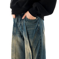 Pantalon décontracté en jean délavé style artisanal, coupe droite ample avec micro-déchirures et motif ondulé, vente en gros