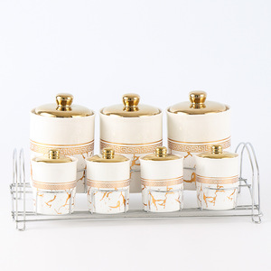 Ensemble de 7 pots à épices en porcelaine au design unique, très demandé, pour la cuisine, avec support métallique - Product Image 1