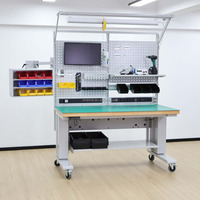 Banc de travail ESD industriel motorisé à hauteur réglable avec double moteur et contrôle de mémoire pour la fabrication électronique, conception personnalisée