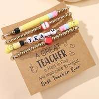 Polymer Clay armband als cadeau voor een leraar met inspirerende kaartje met tekst TEACH INSPIRE letterkraal armband