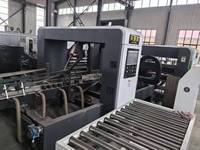 Machine plieuse-colleuse/agrafeuse de cartons automatique d'occasion, état quasi neuf (99%)