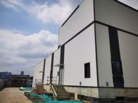 Revêtement mural extérieur moderne en panneaux de fibres-ciment écologiques, ignifuges et sans amiante pour maisons préfabriquées et gymnases