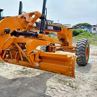 Niveleuse Caterpillar 140 d'occasion, 20 tonnes, pour travaux routiers, avec ripper