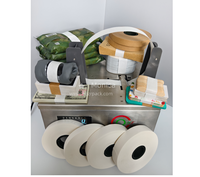 Machine automatique de cerclage de cartons avec bande adhésive, thermoscellante, pour l'emballage manuel des boîtes