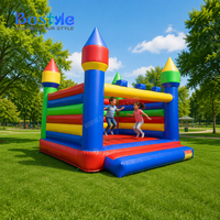 Château gonflable arc-en-ciel multicolore pour enfants, idéal pour la location de jeux d'extérieur