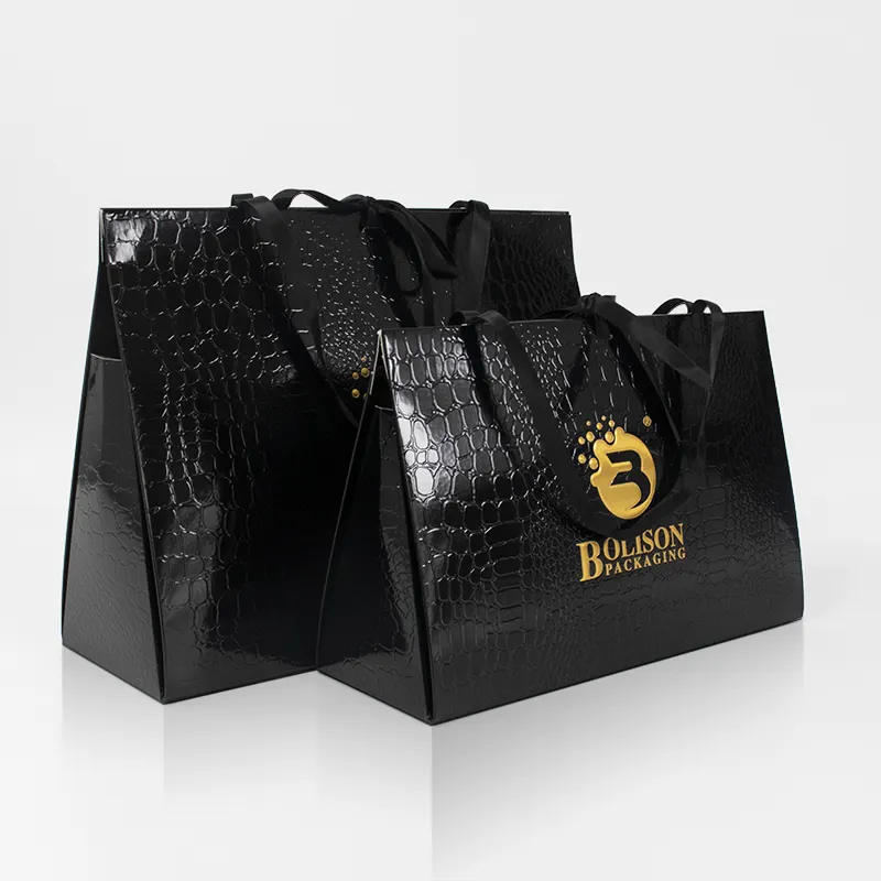 Reutilizable logotipo personalizado estampado en oro impreso negro compras de lujo diseño cosmético hecho a mano regalo en relieve bolsas de papel Premium