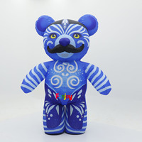 Costume de mascotte gonflable d'ours bébé imprimé sur mesure avec motif bleu, sucette et couche pour spectacle de festival