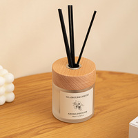 Arôme de décoration de maison de luxe en gros 100ml d'huile essentielle de longue durée diffuseur de roseau de bouteille en verre de marque privée avec couvercle en bois