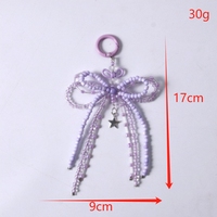 Porte-clés en perles brillantes dans le noir avec nœud lumineux Porte-clés esthétique fait à la main avec nœud papillon Porte-clés avec breloque pour téléphone et ornement de décoration