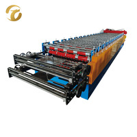 Machine de formage à froid de tôles de toiture ondulées à double couche
