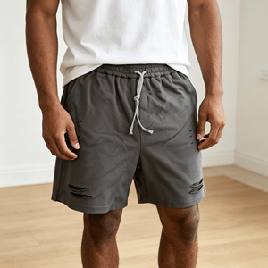 Shorts de survêtement vintage déchirés et délavés pour homme, taille élastique avec cordon de serrage, coupe ample, longueur genou, poches latérales, style streetwear - Product Image 1