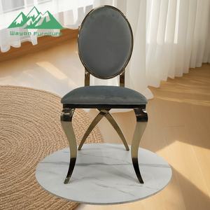 Chaise de salle à manger Wayon de luxe en acier inoxydable argenté, dossier ovale en velours gris, pieds sculptés en croix - Product Image 1