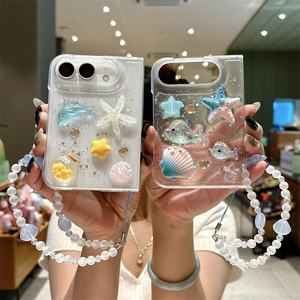 เคสโทรศัพท์ iPhone Duo 18 Fold ลายดาวทะเลเกาหลีวิบวับ ประดับเปลือกหอยและโลมา พร้อมสายคล้องลูกปัด ดีไซน์เก๋ไก๋ทันสมัย - Product Image 1