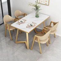Ensemble de salle à manger avec plateau en ardoise et pieds en métal doré