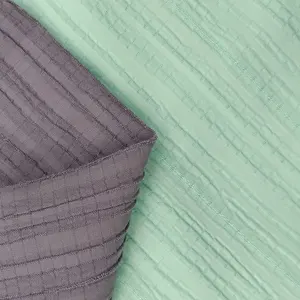 Kustom grosir 100% bahan poliester untuk pakaian crepe kain desain satin untuk pakaian kualitas tinggi crepe berlipat
