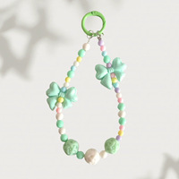 Lanière perlée Macaron Arc-en-ciel avec nœud papillon et breloque fleur rose pour femmes et filles, pendentif de sac en perles acryliques pastel