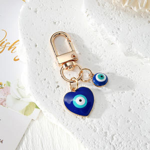 Nouveau design Porte-clés Œil de protection en métal doré avec pendentifs Cœur, Étoile, Hexagone, Amulette porte-bonheur - Product Image 6