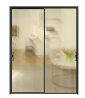 Porte coulissante en verre noir de style moderne avec cadre fin, verre cannelé, pare-vent, cloison intérieure pour les patios de villas