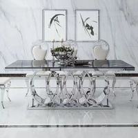 Ensemble de table à manger rectangulaire de luxe pour la salle à manger, avec plateau en marbre et base en acier inoxydable
