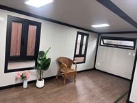 Maison préfabriquée de luxe extensible de 40 pieds, villa modulaire à double aile pliable avec cuisine et chambre