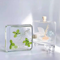Bouteille de parfum en verre vide, carré plat de luxe de 100ml bouteille de diffuseur de parfum à roseaux avec bouchon