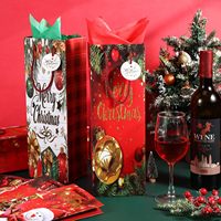 Sac en papier kraft pour vin de Noël avec poignées, imprimé rennes, recyclable, écologique, conception personnalisée, fourni par le fabricant