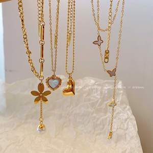 Collana XIXI Antiossidante con Ciondolo a Cuore e <span class=keywords><strong>Farfalla</strong></span> in Acciaio Inox 18K Placcato Oro con Zirconi per Donna - Product Image 1