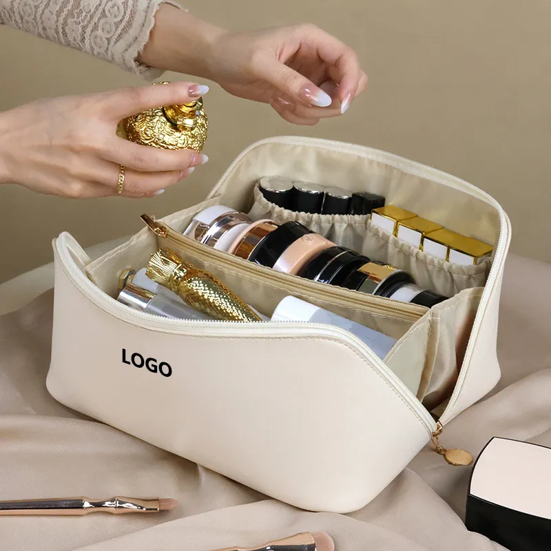 Borsa per il trucco cosmetica in pelle con cuscino in Pu di grande capacità con Logo personalizzato da viaggio impermeabile all'ingrosso con cerniera