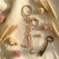 Porte-clés et breloque de sac en alliage de zinc, motif mignon rose émaillé (poisson, chat, nœud papillon, cupcake, clé dorée), accessoires cadeaux pour femmes et filles