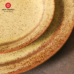 WEIYE fábrica fabricante personalizado platos de cerámica amarillo vidriado manchado circular con diseño platos de porcelana para restaurante
