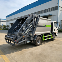 Camion compacteur de déchets puissant Sinotruk HOWO 8CBM avec structure de chargement arrière pour la collecte et l'expédition de déchets industriels