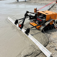 Niveleuse à béton industrielle télécommandée sur chenilles, moteur essence 15 CV pour la construction routière et le nivellement des sols en béton