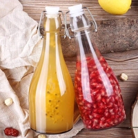 Vente à chaud Big Belly 350ml 500ml 750ml 1000ml Bouteille d'eau ronde en verre transparent Bouteilles de boisson en verre à dessus pivotant avec bouchons