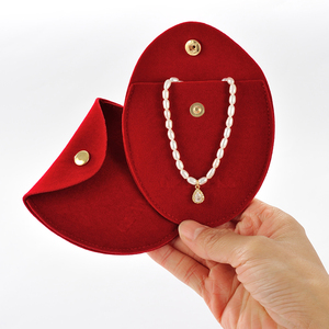 GLAMPKG Custom Small Jewelry Container Unique Design Long Velvet Oval Gold Metal Button Bag With Logo Packaging - Product Image 1