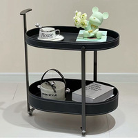 Table d'appoint mobile double couche moderne et légère et luxueuse Table basse ovale avec roulettes Support de rangement simple Design métallique