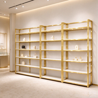 Étagère de présentation ouverte moderne or et blanc, présentoir modulaire multi-niveaux pour cosmétiques et soins de la peau