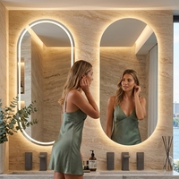 Miroir de salle de bain LED ovale moderne en forme de capsule, sans cadre, rétroéclairé, intelligent, anti-buée, avec variateur tactile pour hôtel et décoration intérieure