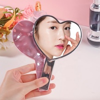 Vente en gros miroir de maquillage portable en forme de coeur miroir de cils de salon miroir de poche rose galvanisé pour fille