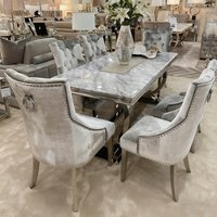 Table à manger moderne haut de gamme à plateau en marbre rectangulaire et pieds en acier inoxydable, assemblée à la main, vente rapide
