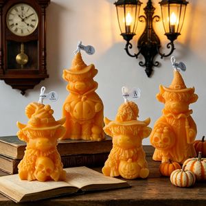 Vela novedosa con forma de vaca de las Tierras Altas y detalles de calavera de calabaza para decoración de mesa festiva - Product Image 1